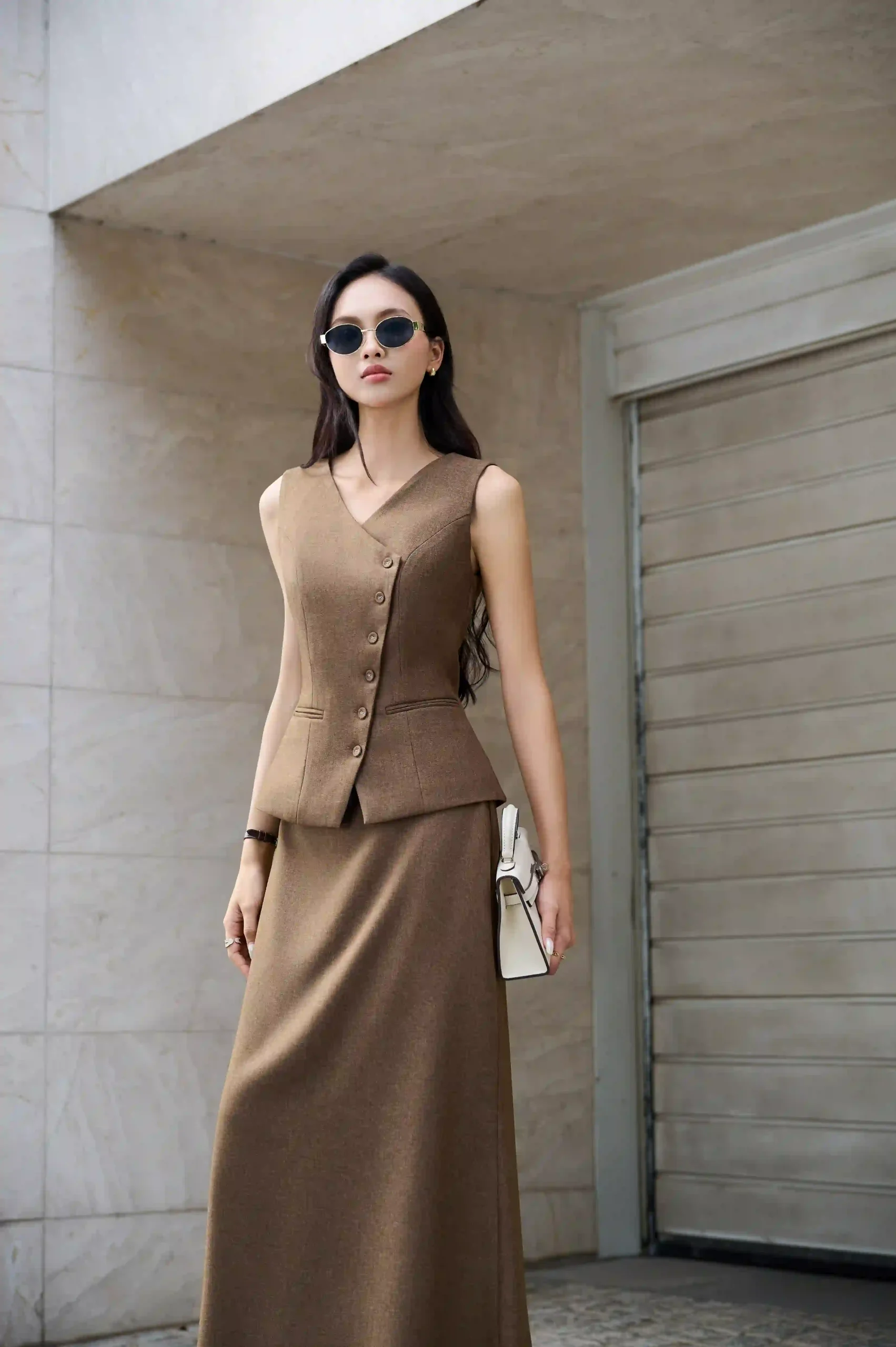 Áo gile hàng cúc lệch